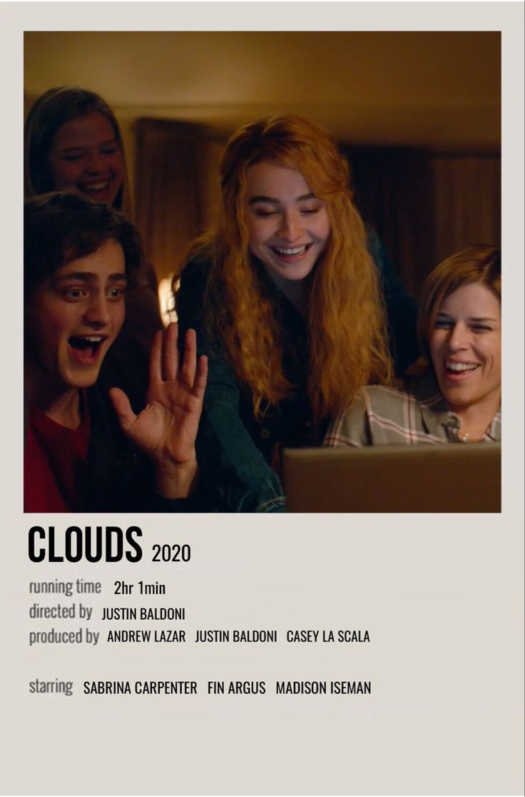 a group of people are laughing and looking at a laptop screen with the words clouds on it