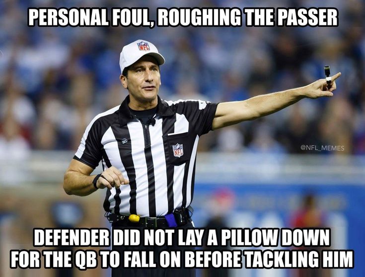 a referee pointing at the ball during a football game with an ad on it that says, personal foul, roughing the passer defender did not pay a blow down for the