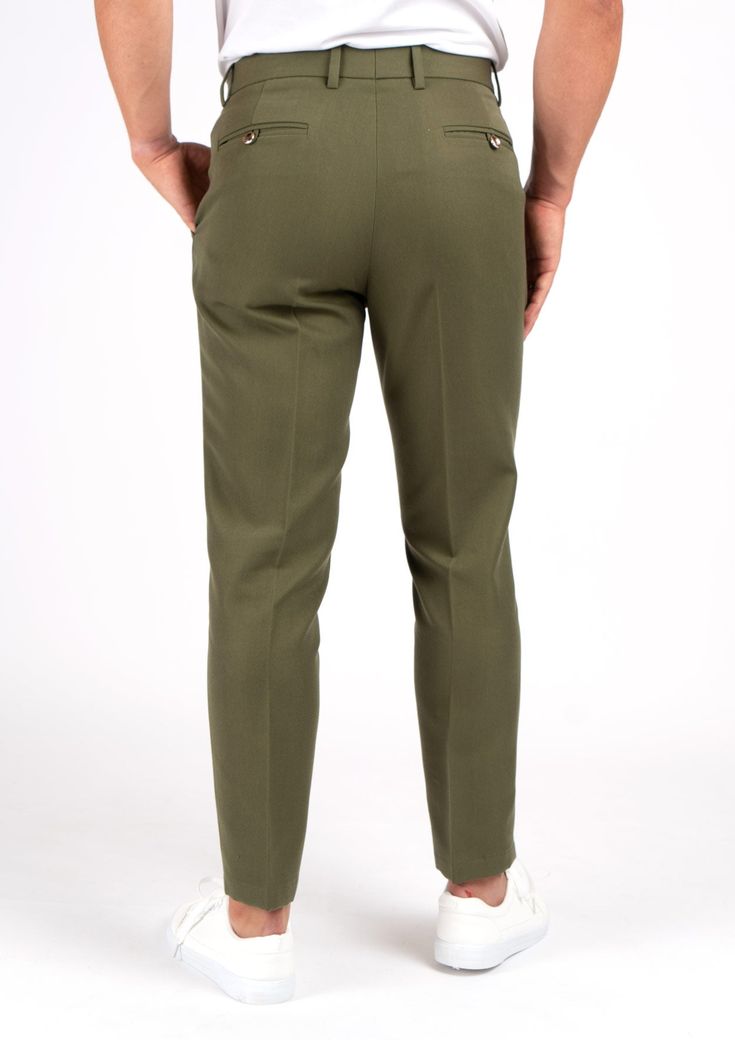 Crafted from a luxurious custom cotton blend, the Olive Cotton Pants offer a refined yet versatile look. These elegant trousers boast a timeless olive hue that will never go out of style. Effortlessly elevate any outfit with these sophisticated premium pants. Elegant Green Bottoms With Welt Pockets, Chic Olive Trousers, Classic Green Workwear Chinos, Green Fitted Classic Chinos, Classic Green Fitted Chinos, Classic Fitted Green Chinos, Classic Green Chinos For Workwear, Chic Olive Pants For Work, Chic Olive Pants For Workwear