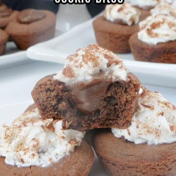 chocolate cupcakes with white frosting and sprinkles are on plates