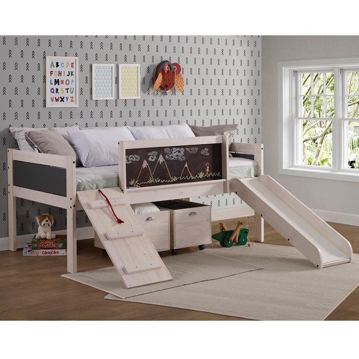 a child's bedroom with a slide and bed