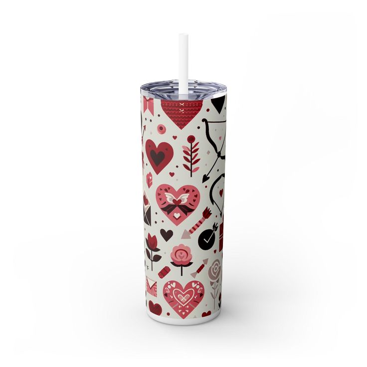 the tumbler cup has hearts and arrows on it, with a straw in its mouth