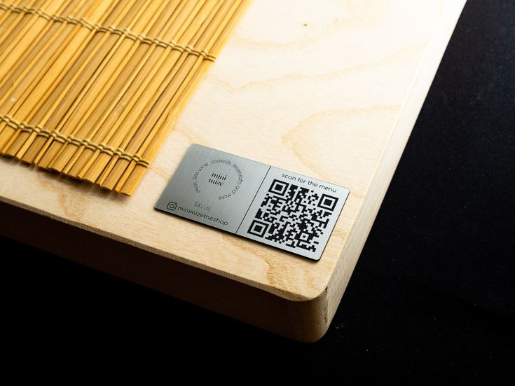 a close up of a wooden table with a qr code on the front and side