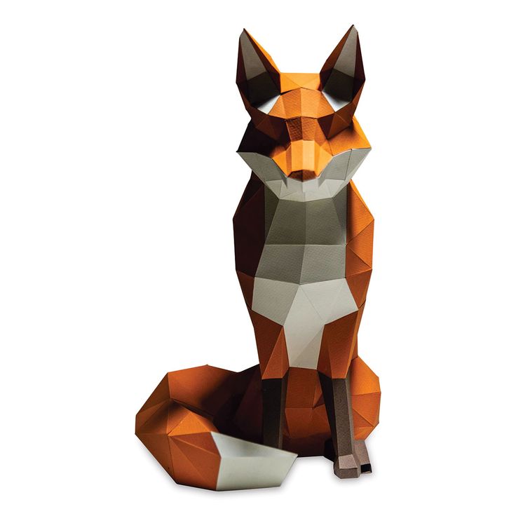 an origami fox sitting on the ground with its head turned to the side