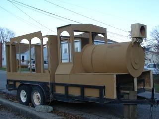 a large brown truck is parked on the side of the road