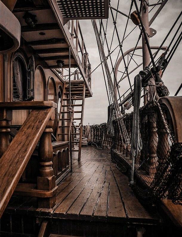 the deck of a ship with ropes and ladders