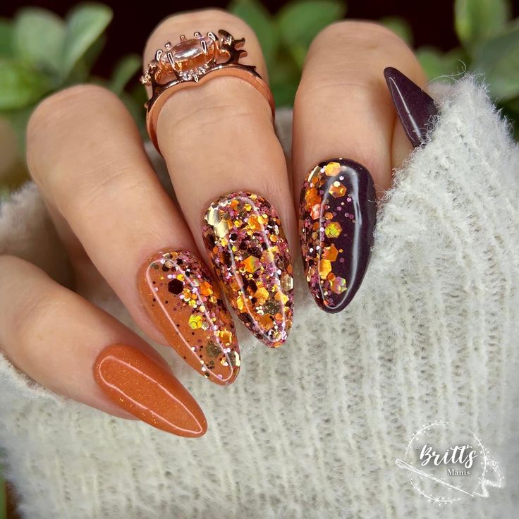 Gorgeous mani features Punkin Spice, Deep Plum, and Cozy, our gorgeous chunky glitter mix with shades of pumpkin, brown, golds and pink.  These colors are perfect to transition into your fall manis.   Dip powders are .25oz jars.  5-7 manis  The number of manis will depend on how many layers of dip you like.  We like 2 layers of dip for solids and most glitters.  Some glitters look great with just one dip.  All of our swatches have been dipped twice.   We add a layer of our Krystal clear dip on top of all glitters and foils. We suggest pouring dip into a cupcake liner, giving it a good mix and then giving it a little shake to bring any glitter or sparkles to the top.  For glitter dips, we like to turn our hand over and "lay" the finger down into the dip and then give everything a very light Glitter Nails Fall Colors, 2 Color Nail Polish Ideas, Fall Nails Each Nail Different Color, Yellow Jacket Nails, Fall Nail Square, Thanksgiven Nails, Olive Green Cheetah Nails, Olive Green Glitter Nails, Winery Nail Designs