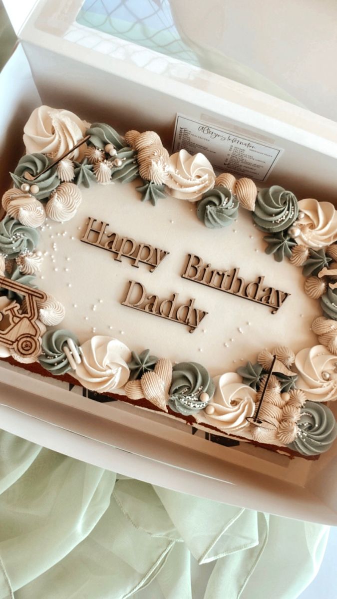 a birthday cake in a box with the words happy birthday daddy written on it