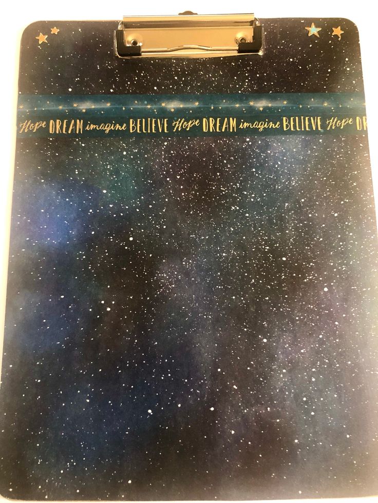 a clipboard with writing and stars on it