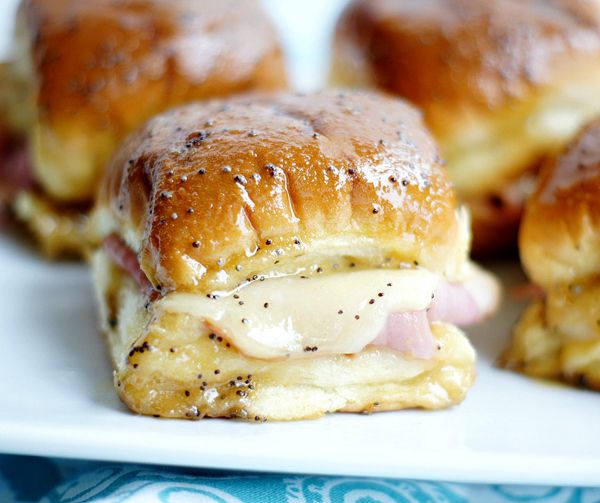 ham and cheese sliders on a white plate