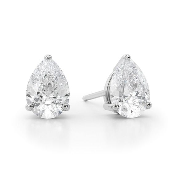 Perfect your everyday look with the timeless sparkle of these luxe pear-shaped diamond solitaire stud earrings in white gold. Crafted in 14K white gold Each earring showcases a 1/2 ct. pear-shaped diamond solitaire. Dazzling with 1 ct. t.w. of diamonds These post earrings secure comfortably with friction backs. Pear-shaped Diamond Cut White Gold Earrings, Platinum Pear-shaped Diamond Earrings With Prong Setting, Classic Pear-shaped White Gold Diamond Earrings, Timeless Pear-shaped Diamond Earrings For Formal Occasions, Classic Platinum Pear-shaped Diamond Earrings, White Pear-shaped Diamond Earrings, White Gold Pear-shaped Diamond Earrings For Formal Occasions, White Gold Pear-shaped Diamond Earrings For Formal Events, White Brilliant Cut Pear Shaped Diamond Earrings