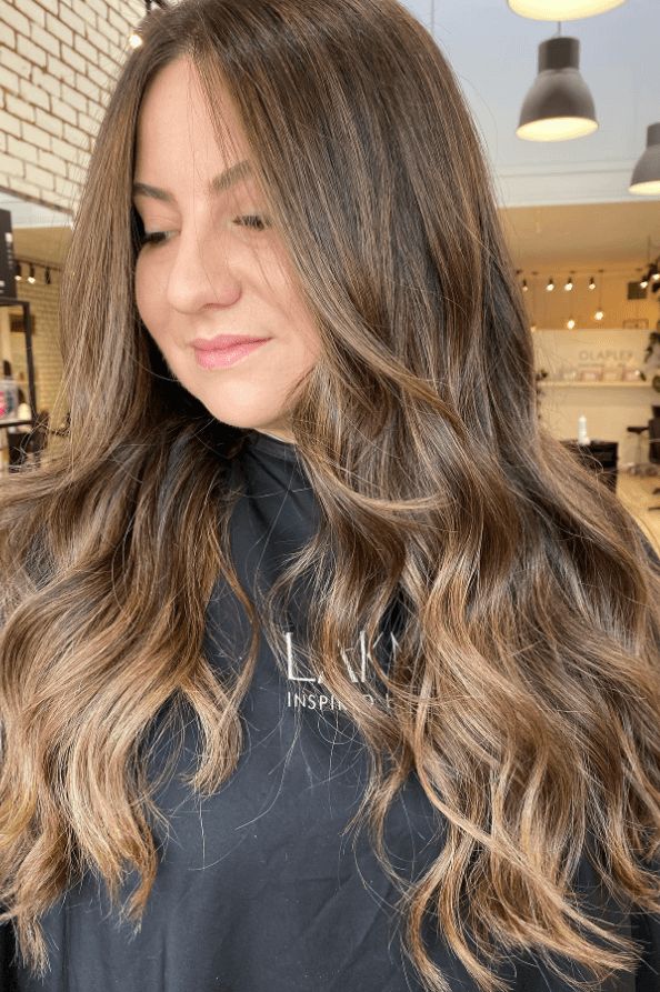 latte hair color, hair ideas, hair trends Latte Hair Color, Soft Caramel Highlights, Brunette Hair Shades, Latte Hair, Subtle Blonde Highlights, Look And Find, Warm Brunette, Wavy Layers, Golden Highlights