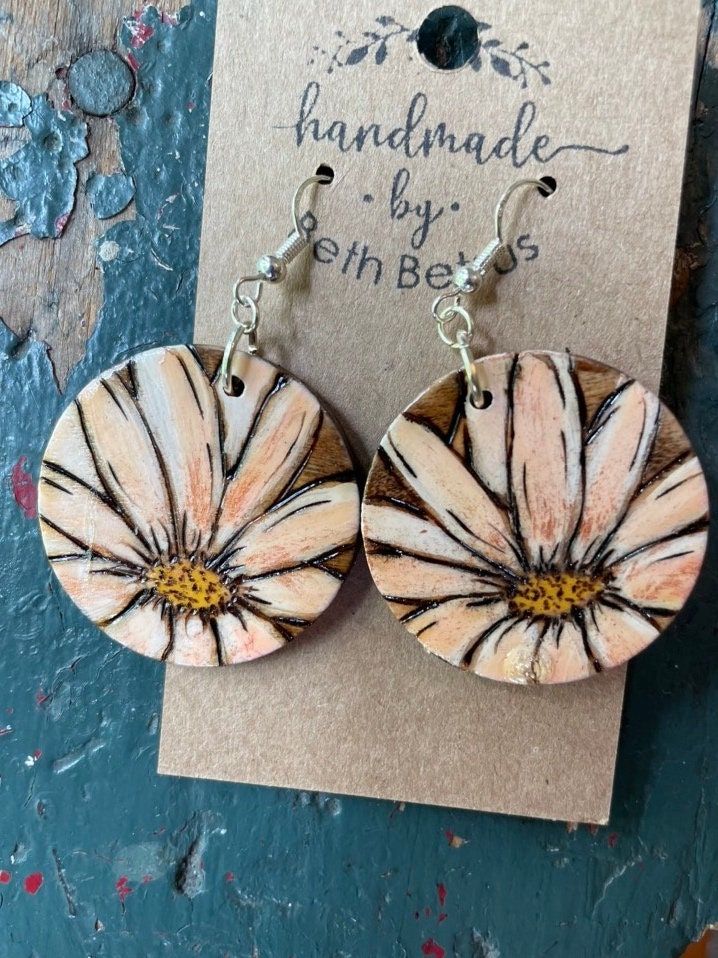 Drawn, wood burned, stained, hand painted, sealed and hung with sterling silver findings. Artistic Hand Painted Brown Earrings, Artistic Hand Painted Brown Jewelry, Handmade Wooden Round Earrings, Handmade Round Wooden Earrings, Artisan Wood Handmade Earrings, Vintage Hand Painted Brown Jewelry, Hand Painted Brown Vintage Jewelry, Handmade Artisan Wood Earrings, Brown Hand Painted Vintage Jewelry