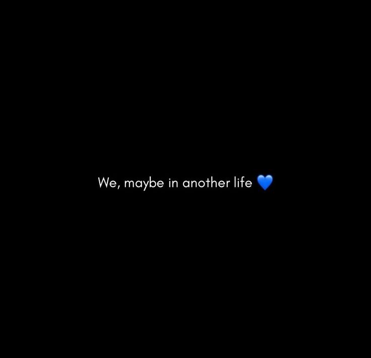 we, maybe in another life text on black background with blue heart shaped paper cutout