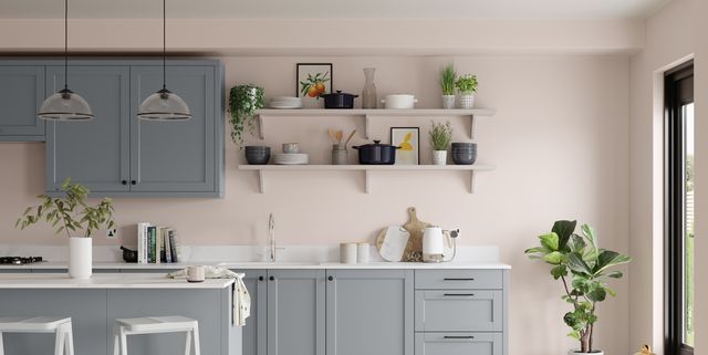 a kitchen filled with lots of counter top space next to a dining room table and chairs