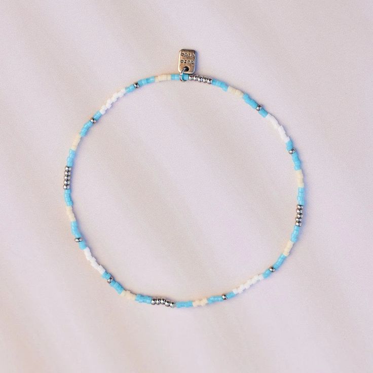 Having perfect style is no small feet—-but our Ventura Stretch Bead Anklet can help make it happen! Available in a turquoise and silver color combo, this slip-on style features delicate heshi beads that’ll have you glimmering from head to toe. Casual Turquoise Jewelry With Tiny Beads, Casual Turquoise Beaded Necklaces With Tiny Beads, Adjustable Silver Beads Anklet For Summer, Adjustable Turquoise Anklet With Tiny Beads, Turquoise Beaded Bracelets For Summer, Turquoise Anklets With Tiny Beads For Festival, Turquoise Round Beads Anklets For Summer, Turquoise Beaded Anklets For Festival, Blue Tiny Beads Anklet For Festival