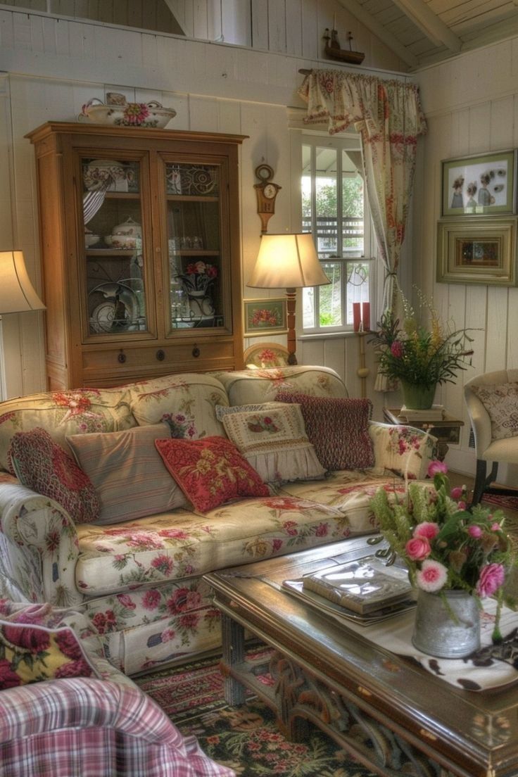 a living room filled with furniture and flowers