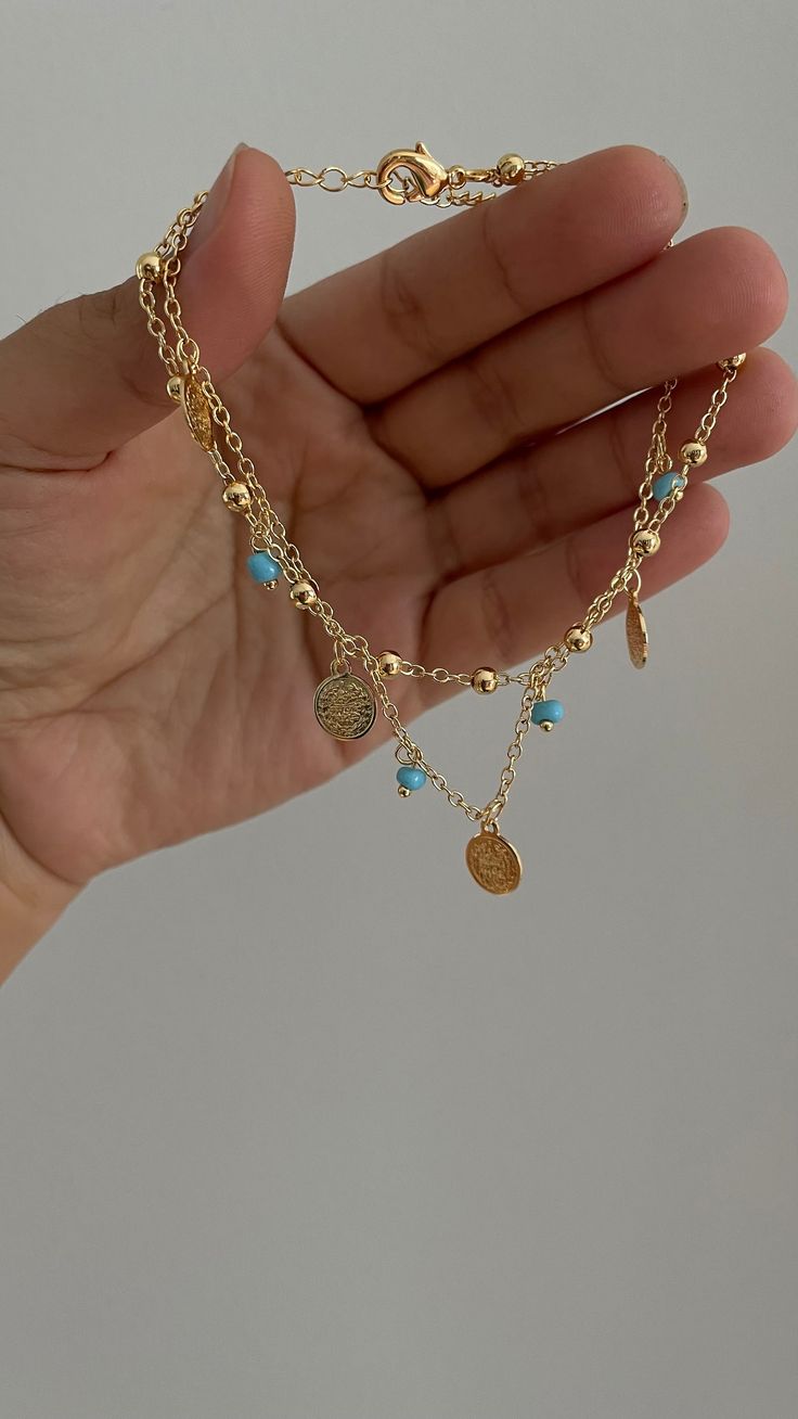 Style 1- Dainty and elegant anklet adorned with 5 mini liras and 4 blue stones.  Style 2- 3 liras with round balls  Style 3- scalloped chain with colorful stones and lirasJewelry for women gifts Middle Eastern style accessories for weddings Kurdish clothes and necklaces earrings belts lira coin jewelry Arabic Balkan Kurdish jewelry for special occasions and every day wear Kurdish Jewelry Jewelry for women minimalistic jewelry middle eastern fusion jewelry middle eastern lira accessories accessor Arabic Accessories, Arabic Clothing Women, Middle Eastern Style, Turquoise And Gold Jewelry, Polish Jewelry Traditional, Turkish Jewellery Gold, Latina Jewelry Aesthetic, Danty Arabian Jewelry, Arab Jewelry Aesthetic