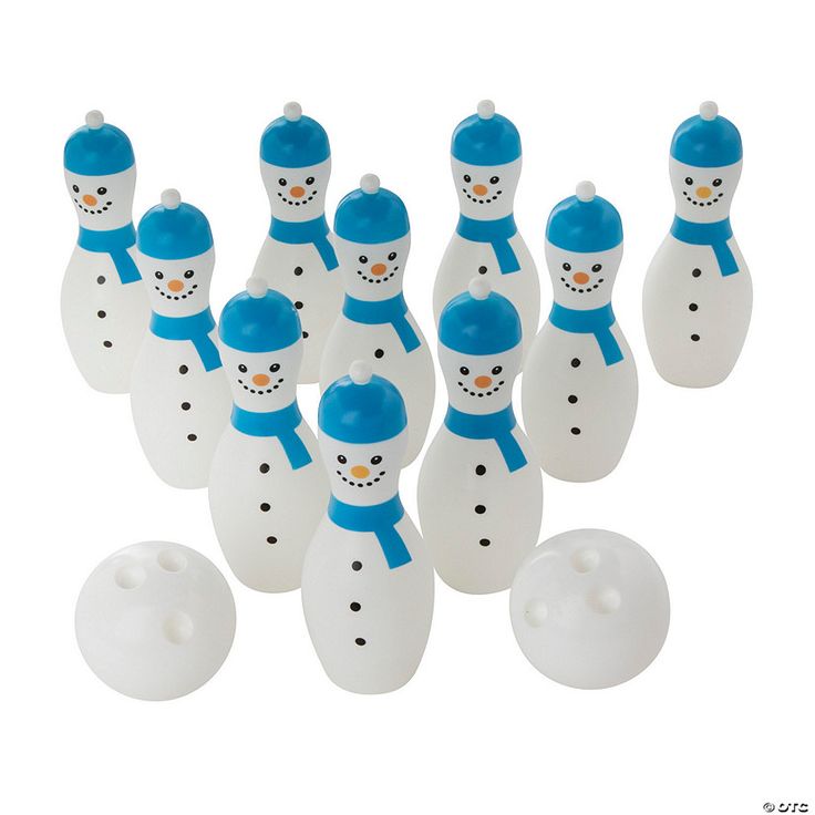 a group of white and blue bowling pins with snowmen on them