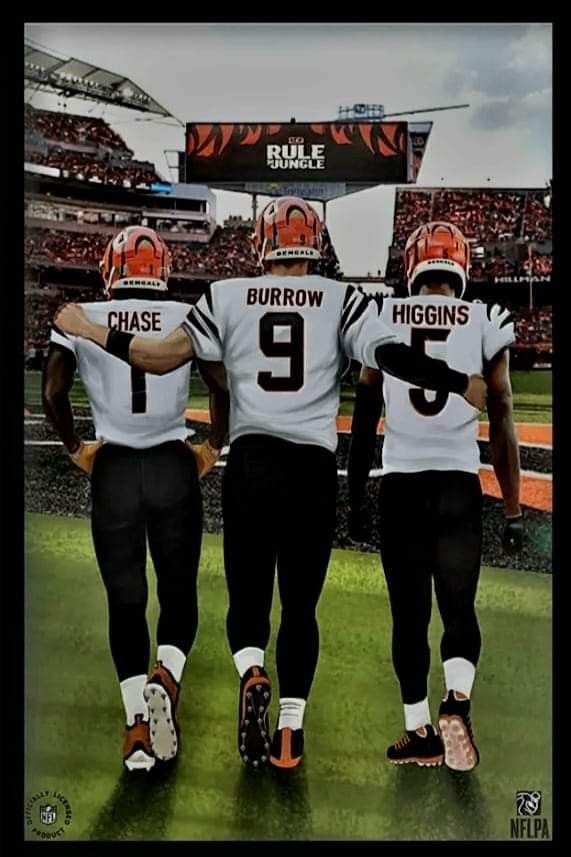 three football players are standing on the field in their uniforms and holding hands behind their backs