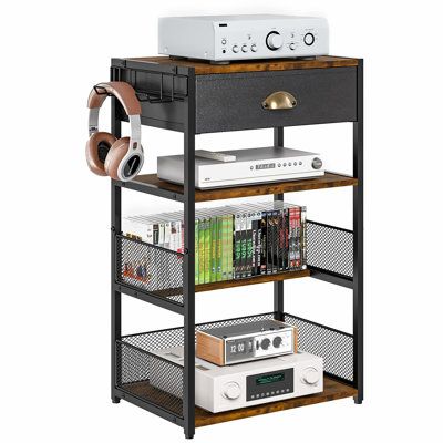 an audio system with headphones on it and bookshelf in front of it