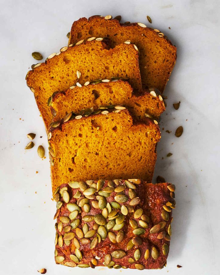 several slices of pumpkin bread with seeds on top