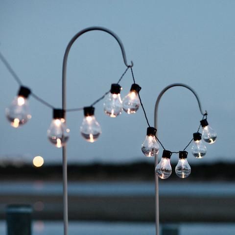 some lights that are hanging from a pole