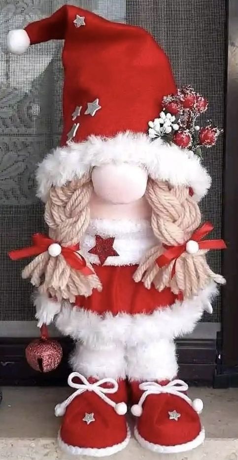 a red and white stuffed animal wearing a santa hat