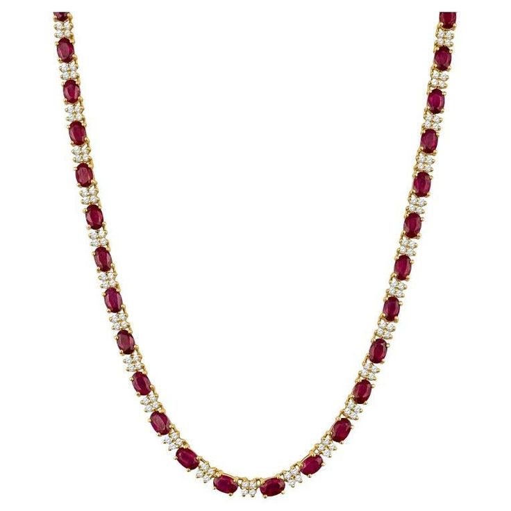 These beautiful and one of a kind vintage necklace features 18.50 carat total weight in oval cut rubies alternating with clusters of approximately 4.10 carat total weight in round diamonds. This necklace is set in 14 karat yellow gold. It is set in 14 karat yellow gold with a box safety clasp. The length is approximately 16.5". Condition: Excellent. No visible signs of wear. Ruby And Diamond Necklace, Black Opal Pendant, Diamond Jewelry Earrings, Jewelry Gift Guide, Opal Pendant Necklace, Tourmaline Pendant, Bridal Engagement Rings, Band Jewelry, Custom Jewelry Design