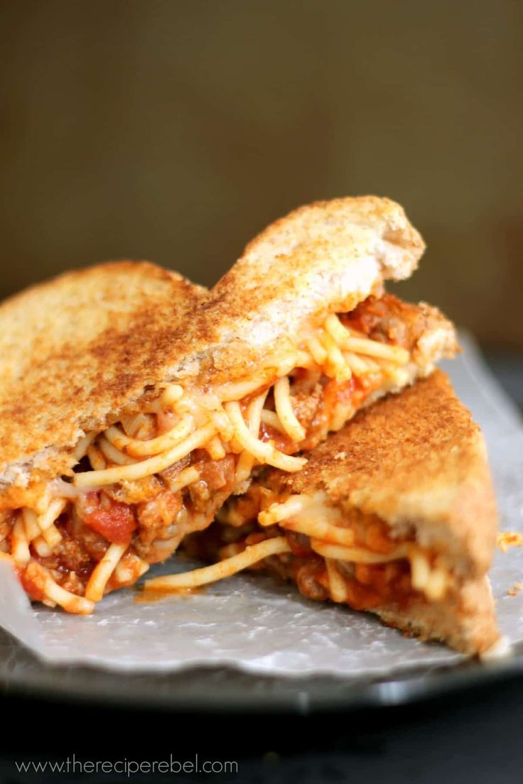 a grilled cheese and tomato sandwich on a plate