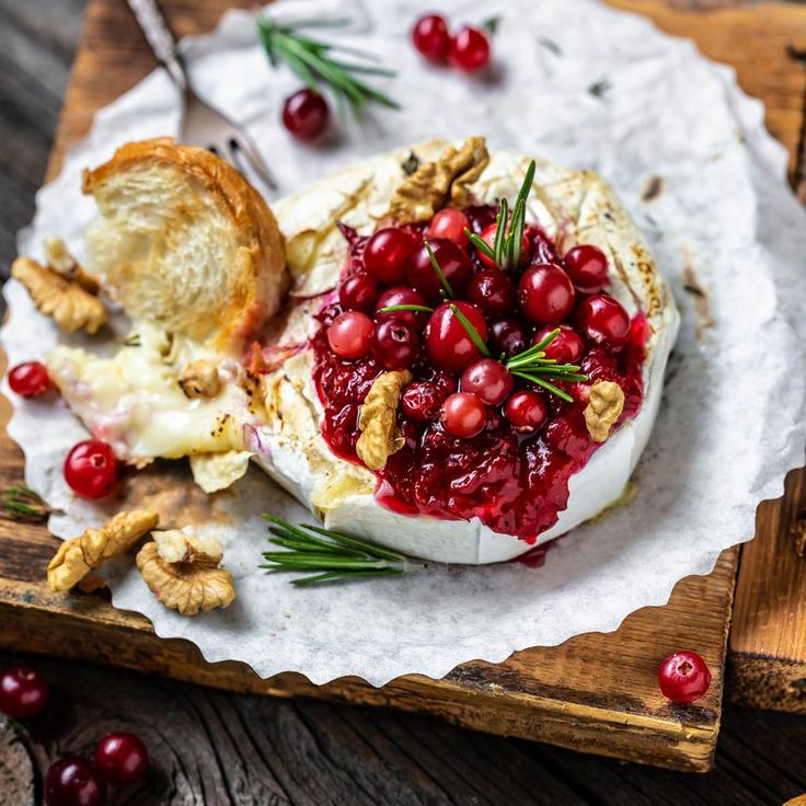 cranberry sauce on an english muffin topped with walnuts and fresh rosemary