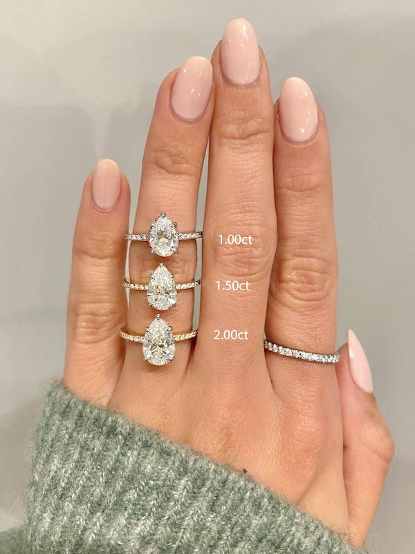 a woman's hand with three diamond rings on it and the measurements for each ring