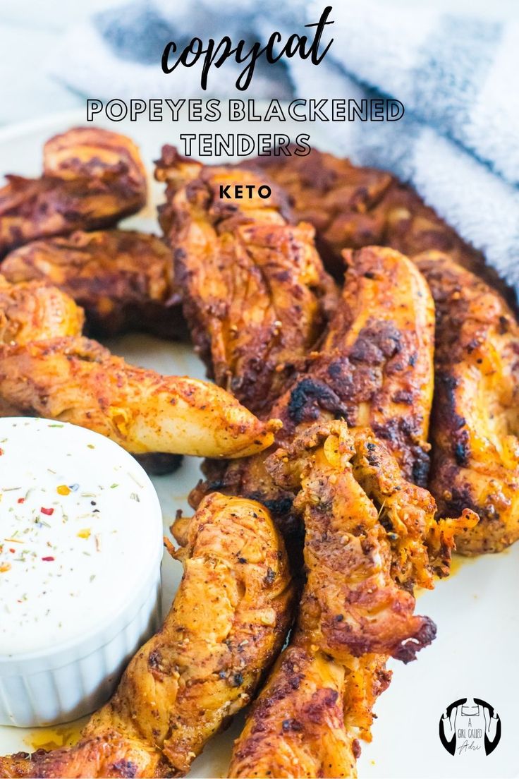 chicken wings on a white plate with ranch dressing and text overlay that reads copycat poppyyes blacked tenders keto