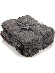 two gray towels with bows on them