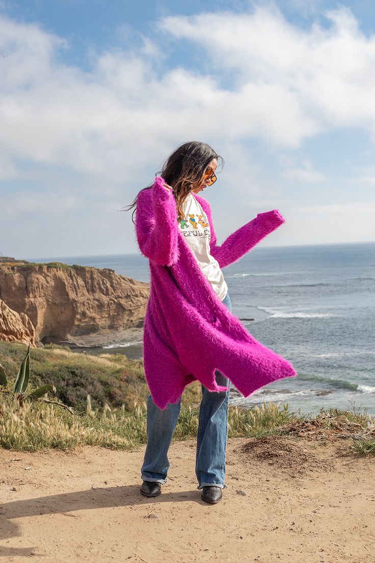 Get cozy with the Kira Soho Cardigan. This long cardigan features an oversized fit and super soft material, perfect for snuggling up on chilly days. With front pockets for added convenience, you'll never want to take this cardigan off. A must-have for any wardrobe! Color: Lilac Fabric: Polyester / Viscose Model wears a small Tumble dry on low Lilac Cardigan, Lilac Fabric, Wardrobe Color, Yoga Shop, Fleetwood Mac, Cardigan Top, Dress With Cardigan, Getting Cozy, Clothing Co