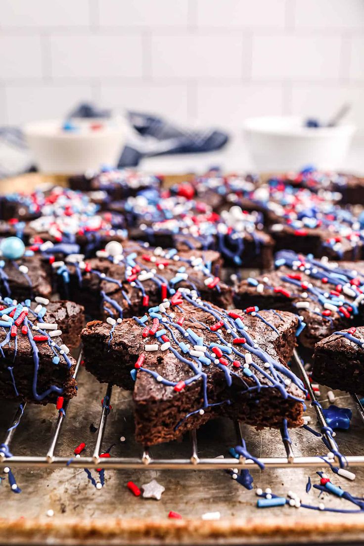 chocolate brownies with red, white and blue sprinkles on a cooling rack