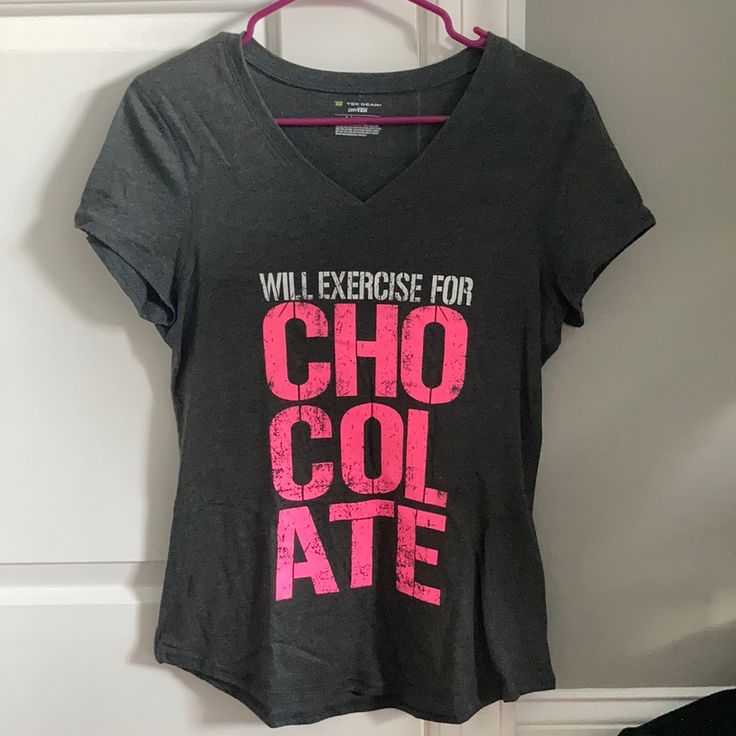 Tek Gear Tshirt: Will Exercise For Chocolate. Dark Grey With White/Pink Writing. Size Small. Never Worn Pink Athleisure Top With Logo Print, Pink Athleisure Top With Graphic Print, Pink Athleisure Tops With Logo Print, Pink Graphic Print Athleisure Top, Pink Tops With Text Print For Workout, Pink Graphic Print T-shirt For Athleisure, Pink Letter Print T-shirt For Workout, Pink Graphic Tee For Workout, Pink Letter Print Workout T-shirt