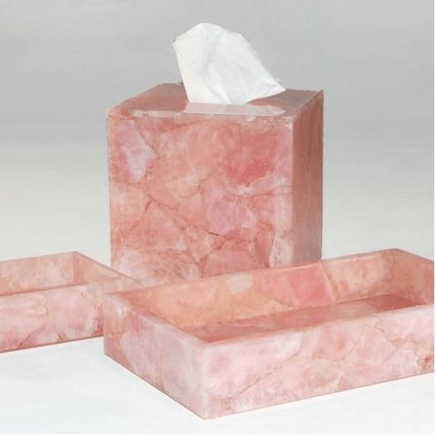 three pieces of pink marble with tissue in them