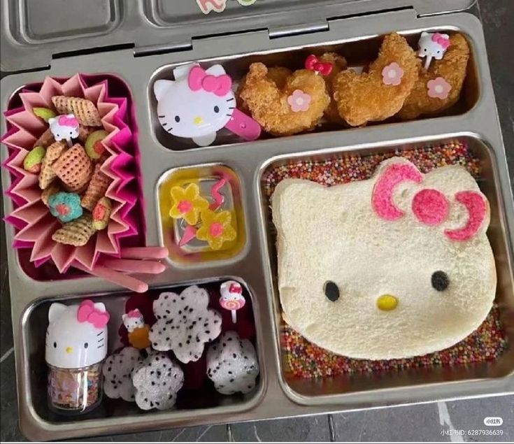 an open hello kitty lunch box filled with food