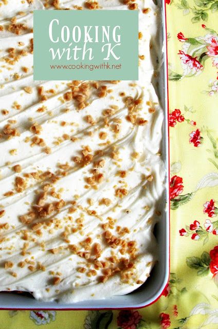 a pan filled with food sitting on top of a floral table cloth covered in flowers