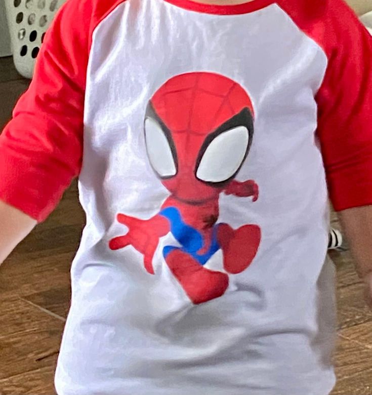 Red & White Toddler Baseball Shirt with Spidey on front and web on back. This cute baseball t-shirt features a white center with bright red half sleeves and collar.   100% Cotton Machine wash warm; tumble dry low; non-chlorine bleach when needed.  Iron inside out if needed. Sporty Red T-shirt With Raglan Sleeves, Red Raglan Sleeve Tops With Graphic Print, Red Graphic Print Raglan Sleeve Top, Playful Red Character Print T-shirt, White Pre-shrunk Short Sleeve Baseball Jersey, White Cotton Baseball Jersey With Short Sleeves, White Cotton Short Sleeve Baseball Jersey, Red Short Sleeve Baseball Jersey With Letter Print, Playful Red T-shirt With Character Print