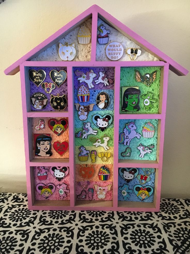 a doll house with lots of stickers on it