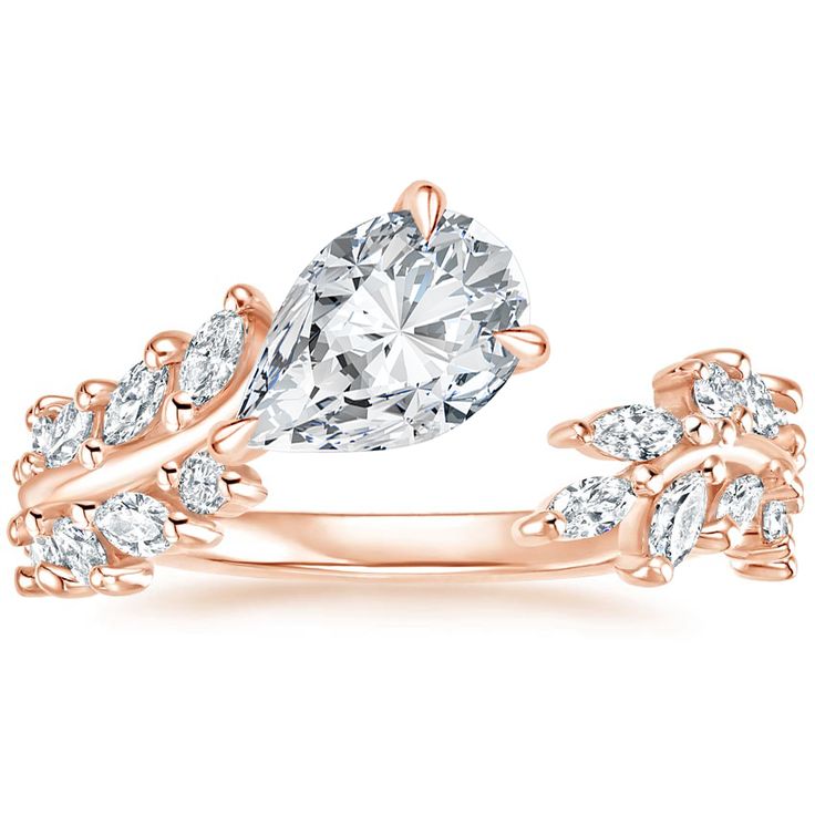 a pear shaped diamond ring with leaves on the band and side stones in 18k rose gold