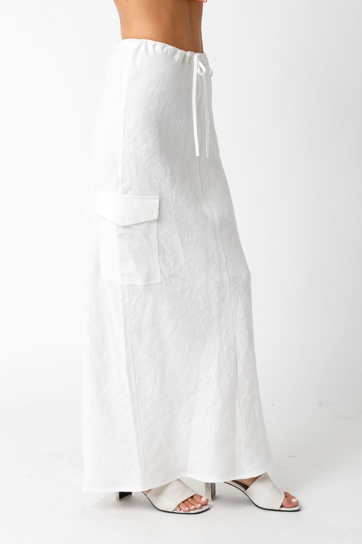 The Kaia White Linen Cargo Maxi Skirt is the perfect vacation cover-up! White linen woven fabric shapes this cargo maxi skirt with a mid-rise fit and drawstring tie. Style with sandals and a cute top and wear to dinner! DETAILS & FIT Loose Fit. 100% Linen. Machine wash cold. Imported. Linen Maxi Skirt, Boho Pink, Maxi Skirt Boho, Low Waisted, White Linen, Cute Tops, Woven Fabric, Casual Style, Maxi Skirt