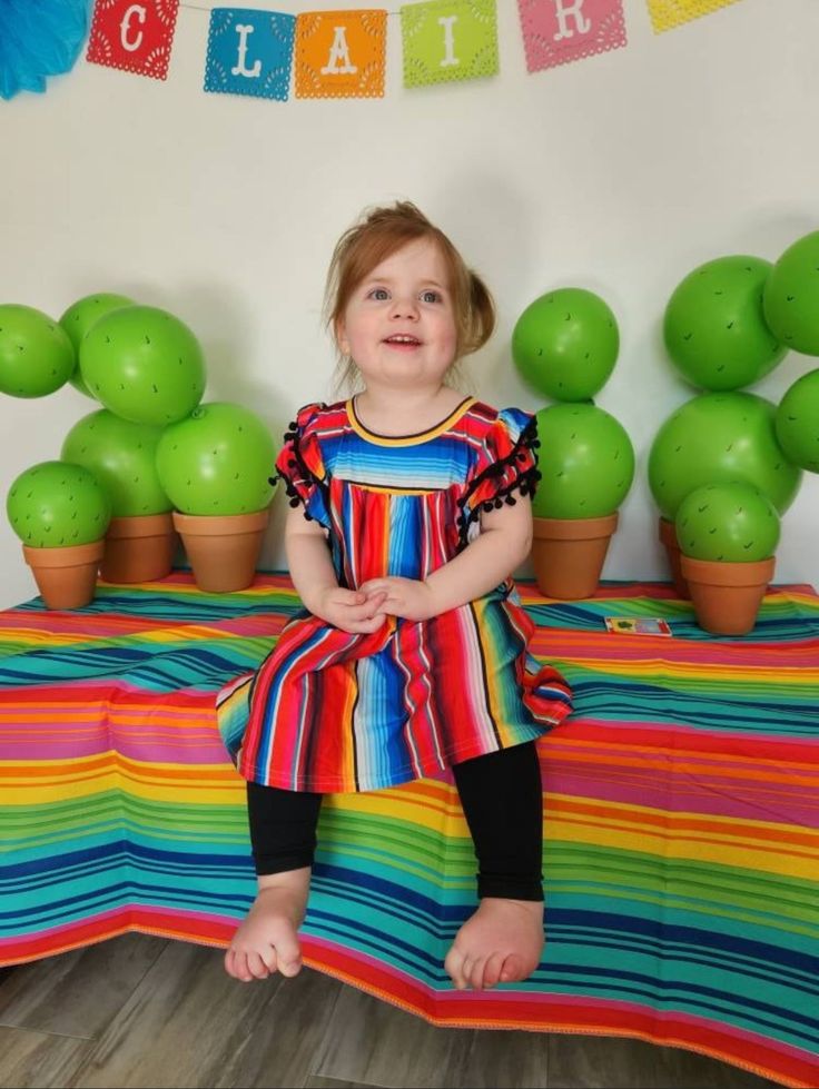 Fun and Festive Serape Dress for Kids! 💗 How fun is this Serape Dress? If you love all things Serape like I do, you’ll adore this stylish piece! ❤️ Each dress features vibrant colors and unique patterns, making every dress one-of-a-kind. Perfect Fit: Available in sizes 1-2T (19" long), 2-3T (20" long), and 4-5T (22" long). Bestseller Alert: This dress is a favorite for good reason! 💥 Stylish Accessories: Complete the look with a matching hand-tied Big Bow Headband! Explore more from our Razels Fitted Multicolor Dress For Birthday, Fun Rainbow Dress For Playtime, Multicolor Twirl Dress For Playtime In Summer, Fun Rainbow Playtime Dress, Multicolor Ruffle Twirl Dress For Playdate, Multicolor Ruffled Twirl Dress For Playdate, Fun Red Birthday Dress, Fitted Rainbow Dresses In Playful Style, Cute Multicolor Dresses For Playtime