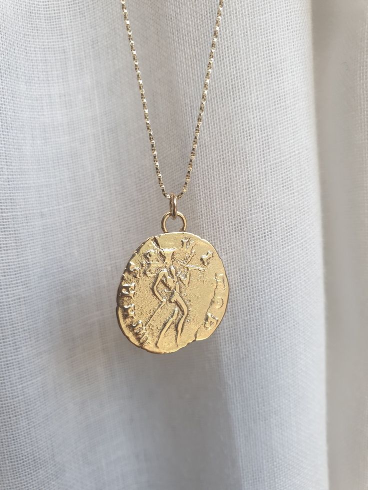 This 14k solid gold coin necklace was 100% handmade and has an antique Roman coin for a pendant. The necklace is available with 14k solid gold or 14k gold filled chain. The pendant is available in 9k or 14k solid gold. You can also buy the pendant only if you wish. Dimensions: The 14k gold necklace is available in multiple lengths. The antique coin pendent's diameter is 1.5 cm (0.6 inches) This ancient coin necklace is unique and beautiful and will serve you long and well. To see other necklaces Antique Gold Sterling Silver Coin Necklace, Antique Sterling Silver Gold Coin Necklace, Antique 14k Gold Coin Necklace, 14k Gold Tarnish Resistant Coin Necklace, 14k Gold Tarnish-resistant Coin Necklace, Sterling Silver Gold Medallion Coin Necklace, Yellow Gold Sterling Silver Coin Medallion Necklace, Yellow Gold Coin Pendant Necklace In Sterling Silver, 14k Gold Medallion Coin Necklace