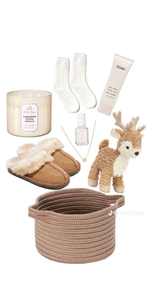 the contents of a gift set including slippers, socks and a candle