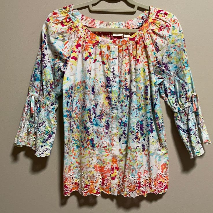 Westbound Floral Peasant Top. A Colorful Summery Print With Scalloped Eyelet Edging. Smocked At Back Neckline. 3/4 Sleeved With Elastic And Ties. Popover With Nonfunctional Buttons Down Front. Purchased At Dillards. Size Small. Pit To Pit: 20”. New With Tags. Don't Have A Poshmark Account? Use My Code Msbelize1 When You Sign Up To Receive A $10 Credit To Use On Your First Purchase Multicolor 3/4 Sleeve Top For Vacation, Spring Beach Smock Blouse, Multicolor 3/4 Sleeve Vacation Blouse, Spring Smock Blouse For Beach, Multicolor 3/4 Sleeve Blouse For Vacation, Multicolor 3/4 Sleeve Tops For Beach, Casual Multicolor Smock Tops, Summer Peasant Top With 3/4 Sleeves, Peasant Style 3/4 Sleeve Top For Summer