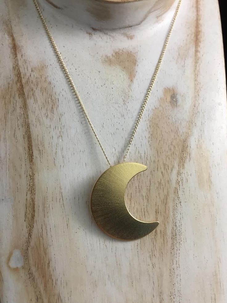 "Featuring the likeness of Stevie Nicks' own sterling silver 1 1/4\" crescent moon (20 gauge in thickness). Comes with a gold-gilled curb chain with the pendant facing left, towards the heart, just like Stevie wears. :) There is a 24K gold-plating overlay on the sterling silver moon pendant for a real gold finish without the expense of solid gold. The curb chain is gold-filled, which has more gold content than a plated chain. I draw the moon layout on sterling sheet, then pierce and cut the shap Gold Moon-shaped Engraved Necklace, Gold Crescent Celestial Necklace, Celestial Crescent Gold Necklace, Gold Necklaces With Sun And Moon Half Moon Design, Gold Moon-shaped Engraved Jewelry, Gold Necklaces With Sun And Moon Design, Gold Engraved Moon-shaped Jewelry, Gold Half Moon Celestial Necklace, Crescent Moon Phase Brass Jewelry