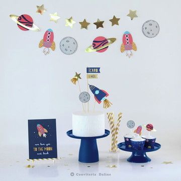 a space themed birthday party with cake and decorations